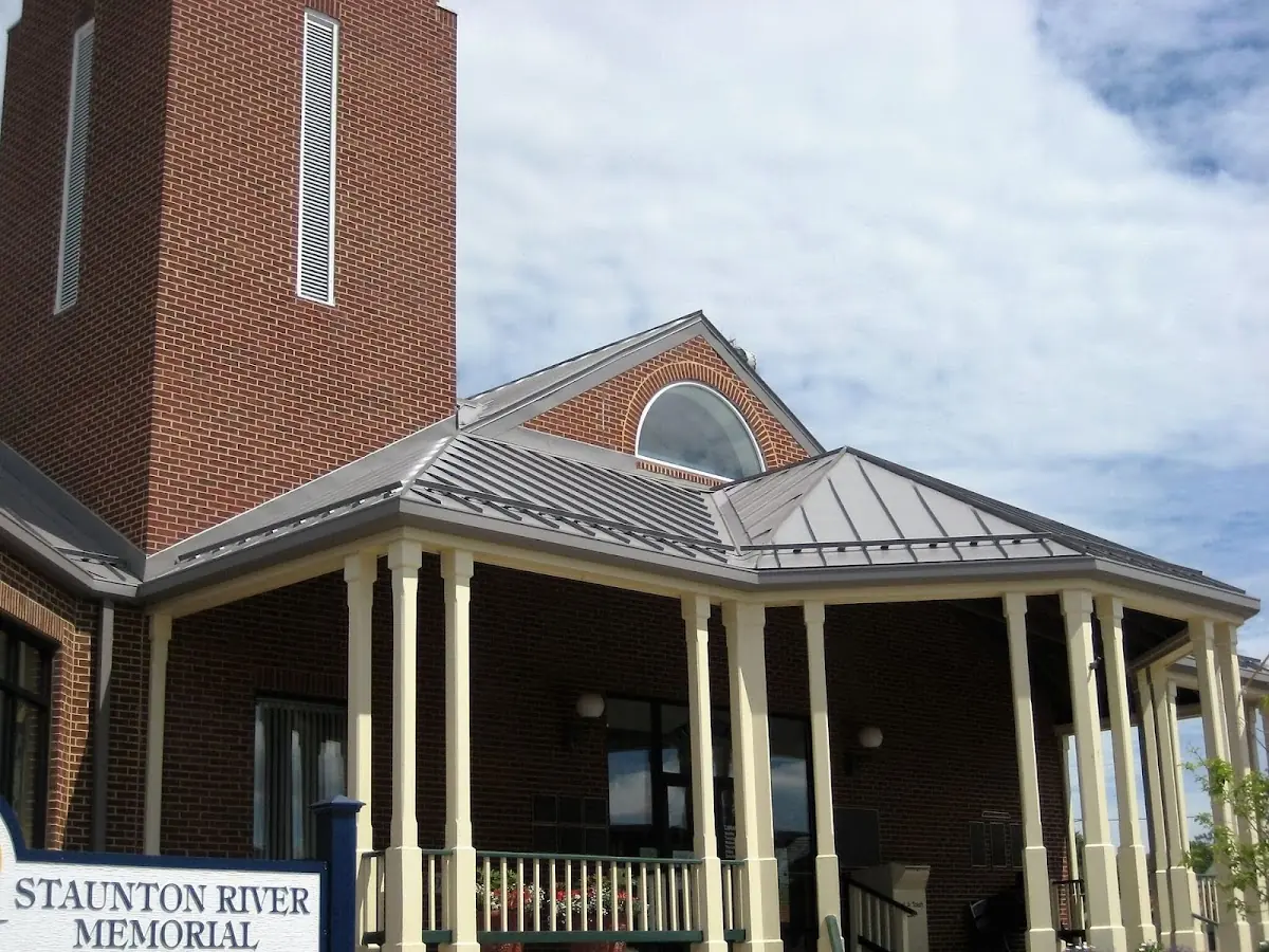 Skilled roofing craftsmen working on a residential roof in Town Hall